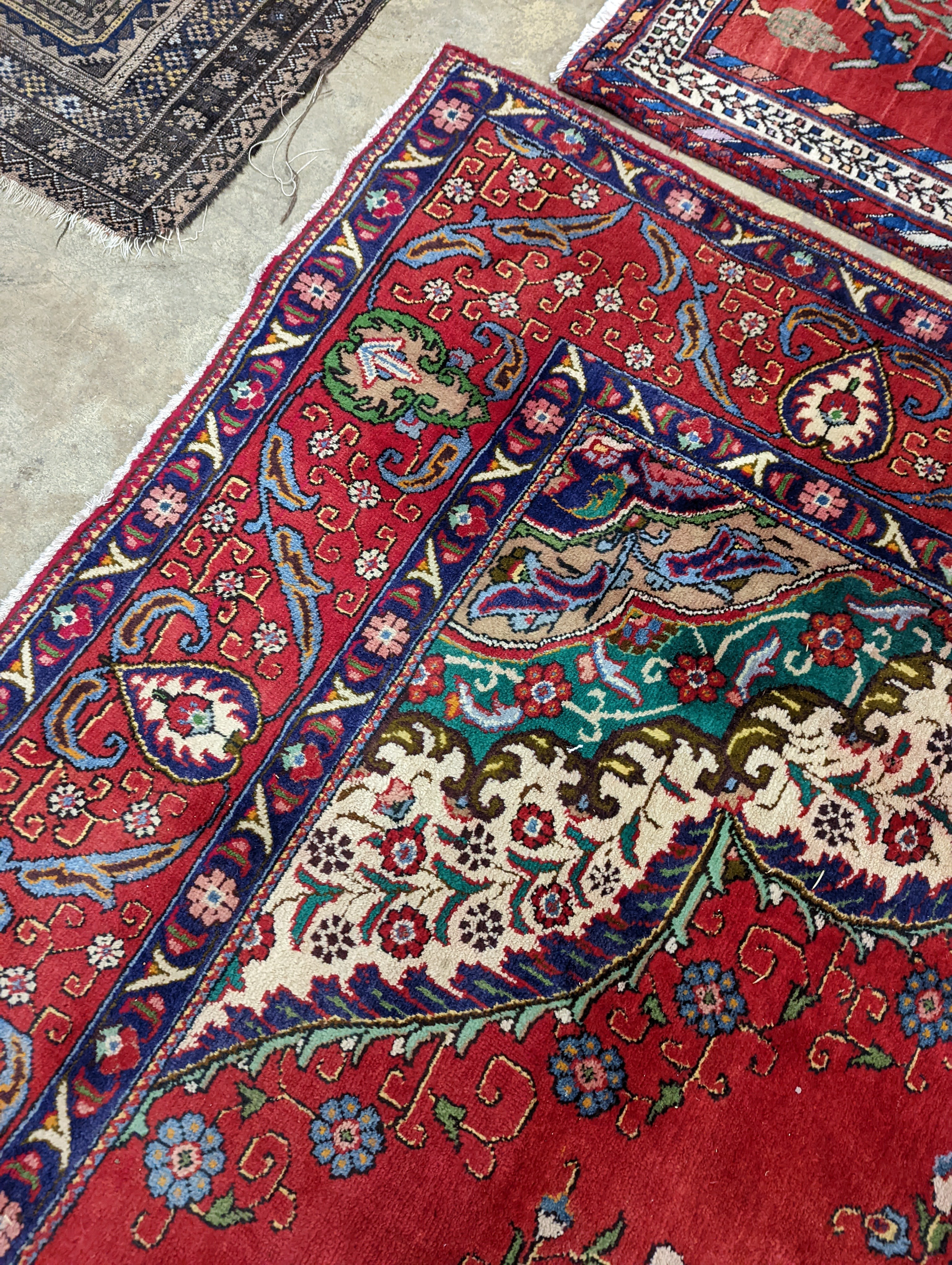 A Tabriz red ground carpet, 380 x 300cm